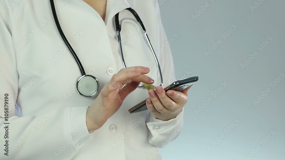 Female medical employee viewing lab results using smartphone, technical progress