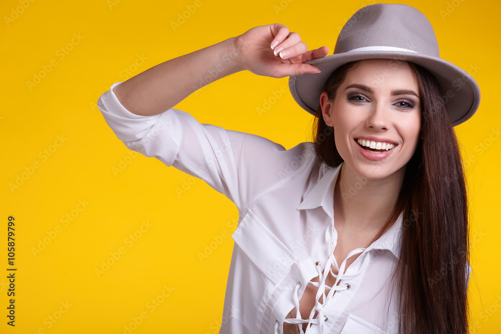 young brunette woman in spring color isolated on yellow backgrou young brunette woman in spring color isolated on yellow backgrou