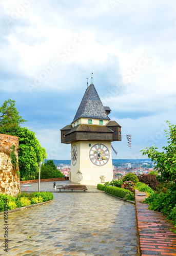 Uhrturm, Clock tower of Graz in spring on rainy and cloudy day, Austria.
