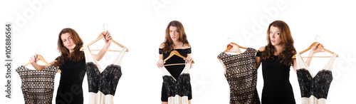 Young woman trying new clothing on white