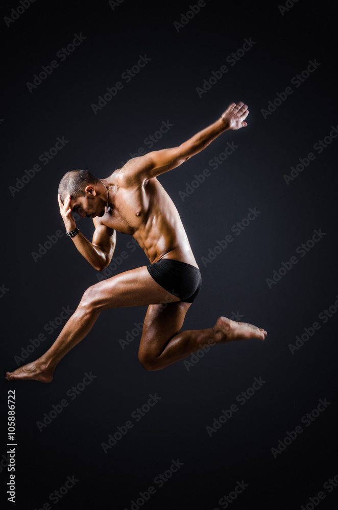 Ripped muscular man in sports concept