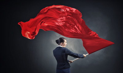 Woman waving red flag
