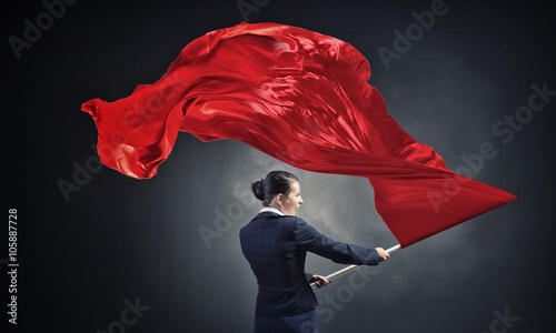 Φωτογραφία Woman waving red flag