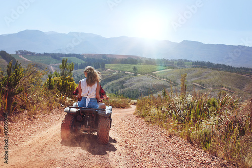 Young couple on an atv photo