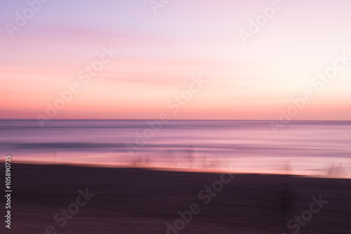 Fototapeta Naklejka Na Ścianę i Meble -  Blur people relax on tropical sunset beach abstract background.