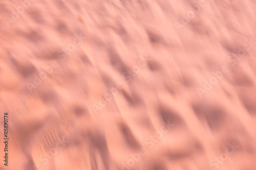 Blurred sand sunset on beach use as abstract background.