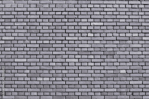 Lilac gray colored brick wall background