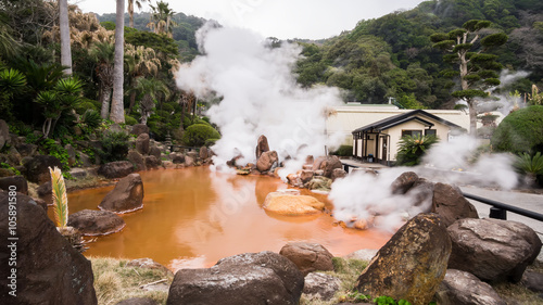 Small orange color hell near the sea hell in Beppu , Japan photo