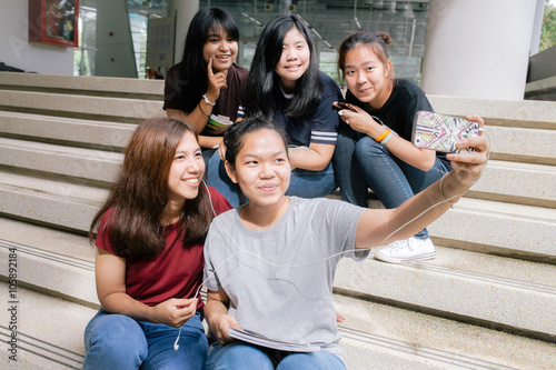 group of happy teen high school students outdoors, Asian, tutoring, Take a photo
