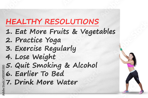 Woman pushes banner with healthy resolutions