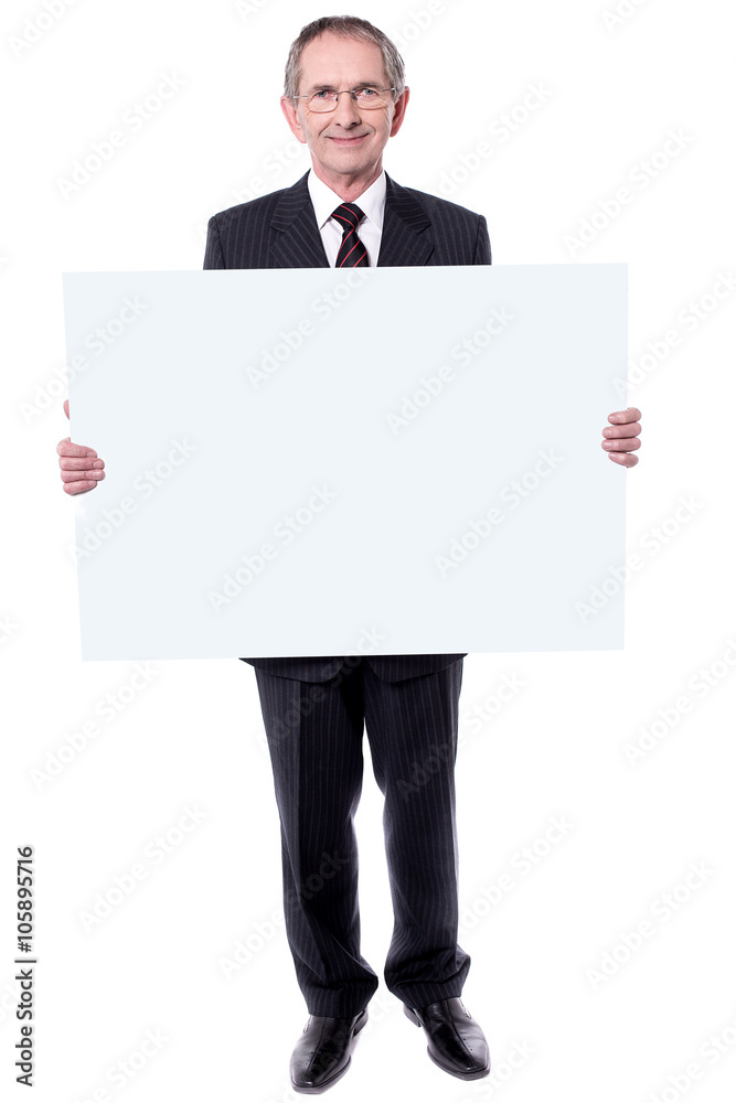 Handsome aged man holding blank white billboard Handsome aged man holding blank white billboard