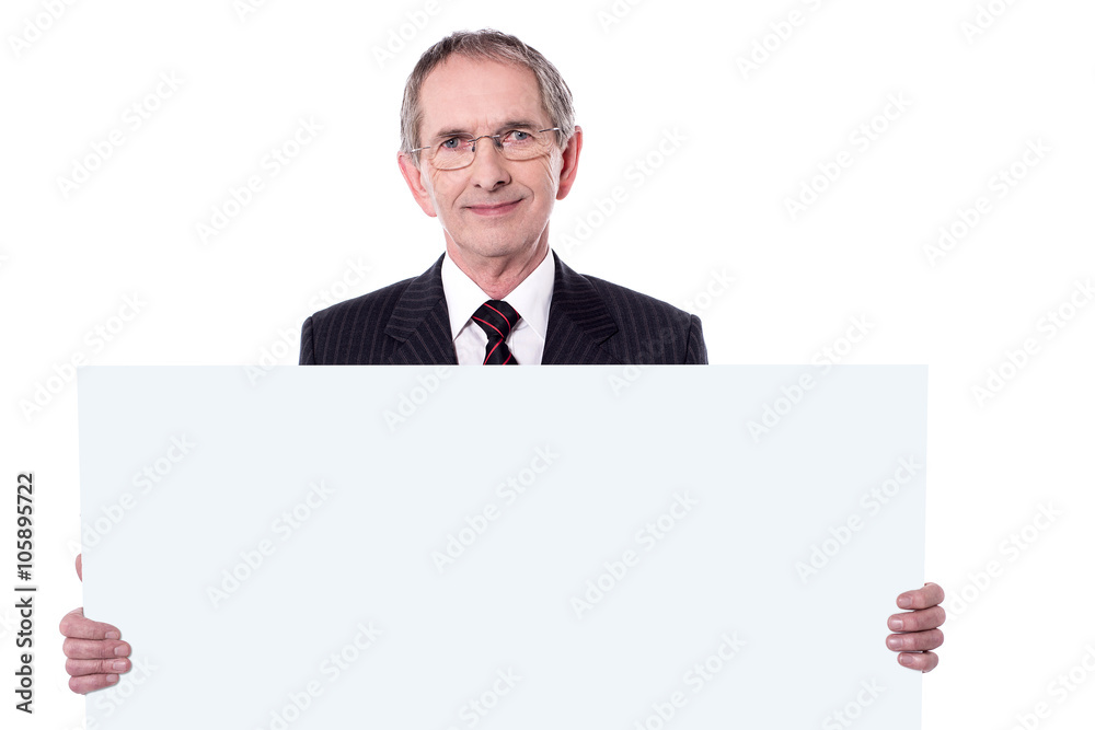 Senior business professional displaying blank ad Senior business professional displaying blank ad
