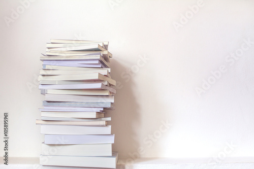 Close up book stacked with concrete wall background