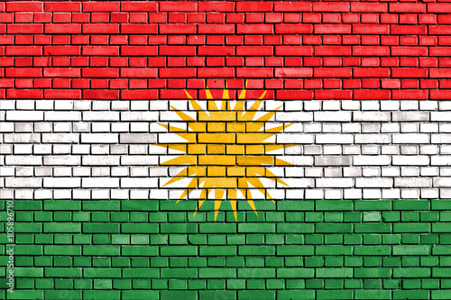 flag of Kurdistan painted on brick wall photo