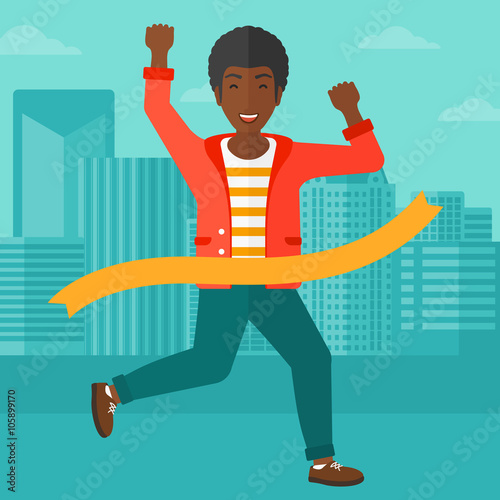 Businessman crossing finish line.