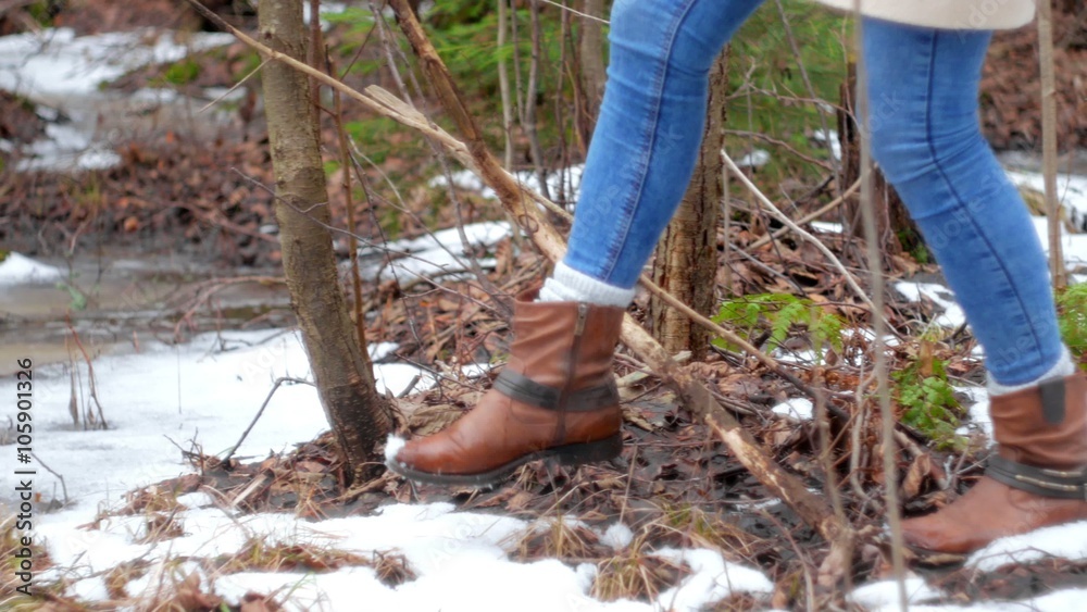Girl is walking on snowy path near the forest Girl is walking on snowy path near the forest