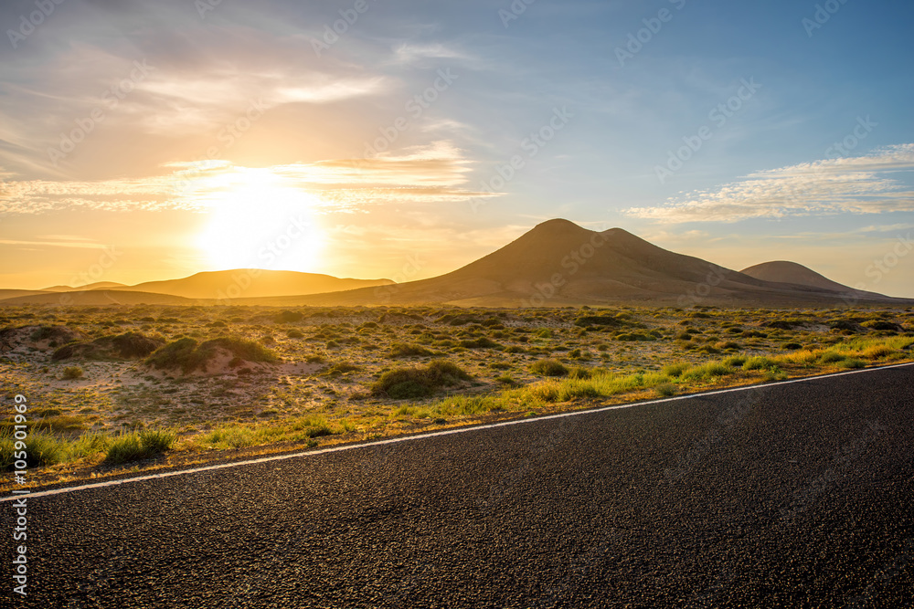 Mountains and road on Fuerteventura island on the sunset  - obrazy, fototapety, plakaty 