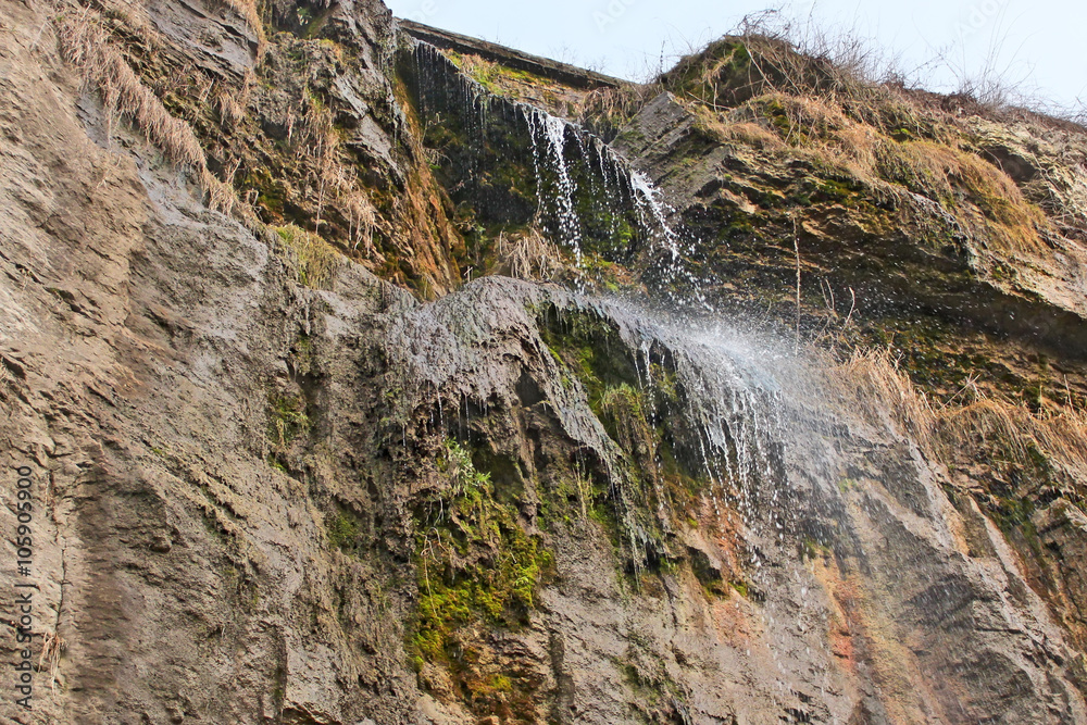 High waterfall on a cliff High waterfall on a cliff