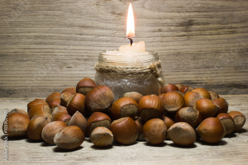 Hazelnut in shell on wooden background