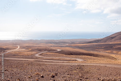 Deserted landscape with ground road on Jandia peninsula on Fuerteventura island in Spain