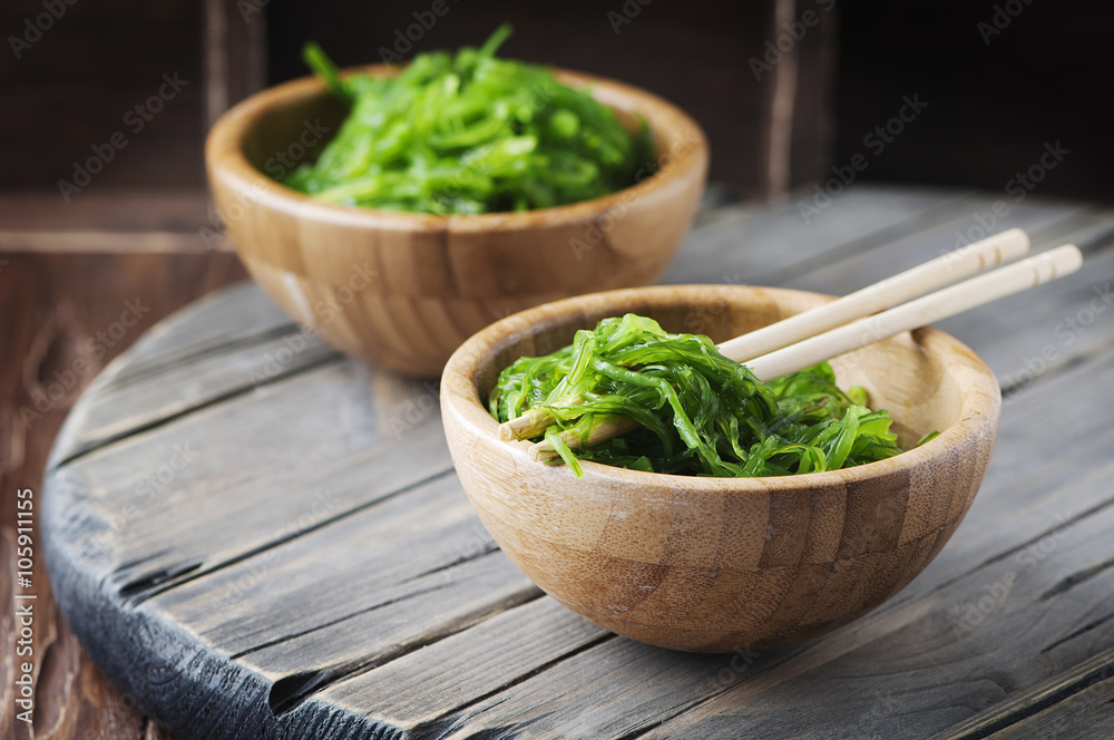 Traditional Japanese salad chuka on the wooden table Traditional Japanese salad chuka on the wooden table