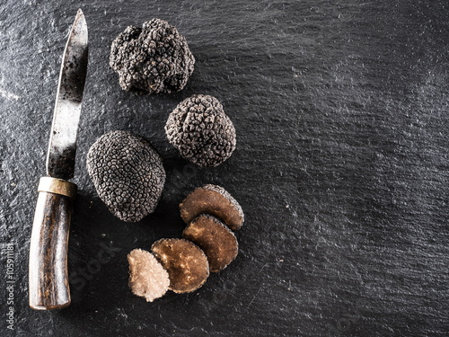 Black truffles on the graphite board.