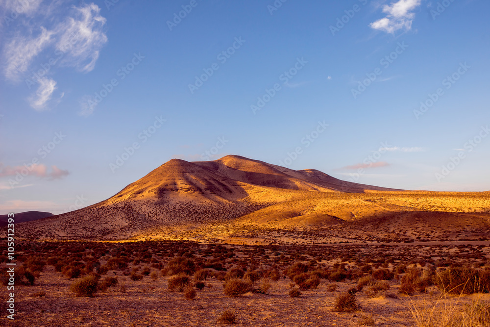 Beautiful deserted landscape with soft mountains on Fuerteventura island in Spain