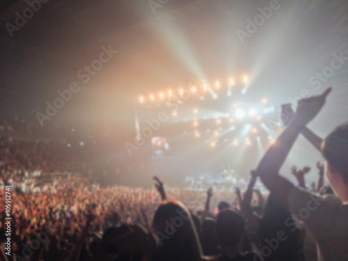 Blurred background : Bokeh lighting in indoor concert with cheering audience