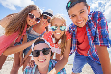 funny portrait of group of teenagers spending time together