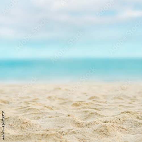 Close up sand with blurred sea sky background  summer day  copy space or for product.