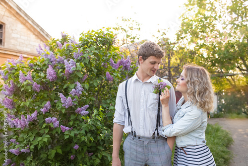young couple near lilac tree