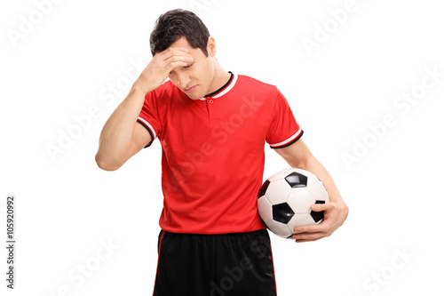 Fotografi Sad football player looking down