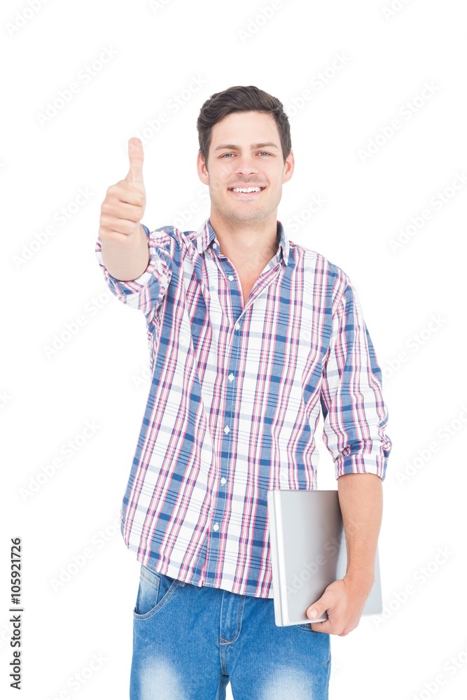 Portrait of smiling male student holding a laptop Portrait of smiling male student holding a laptop