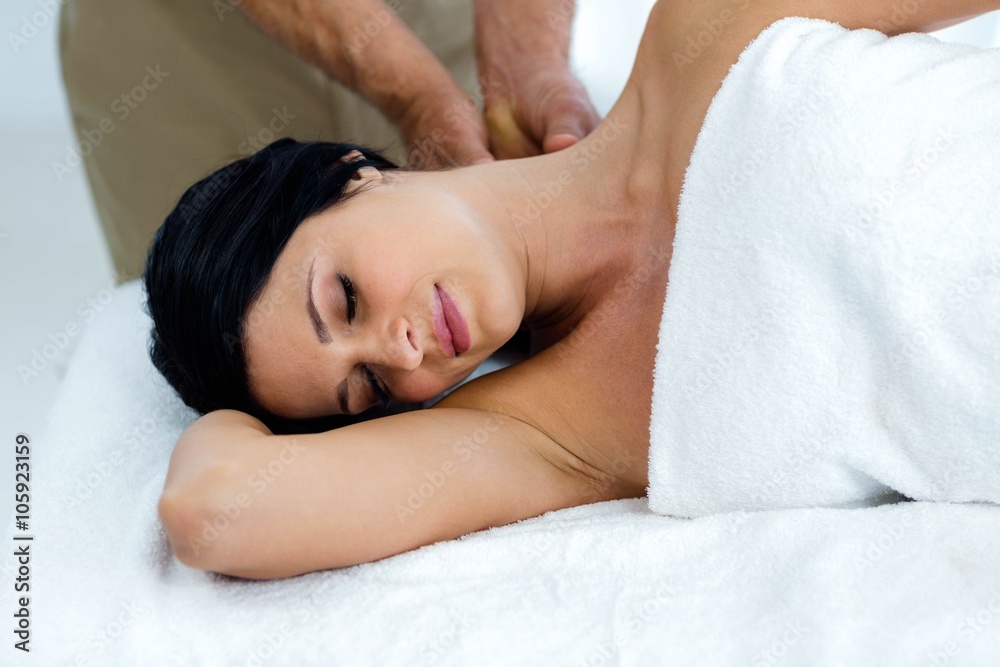 Pregnant woman receiving a back massage from masseur Pregnant woman receiving a back massage from masseur