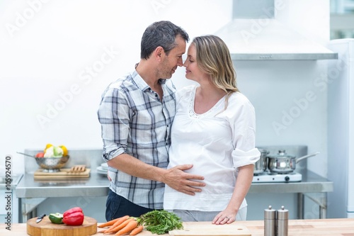 Man face to face with pregnant woman