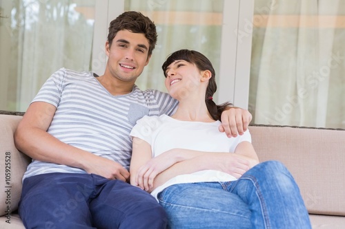 Young couple sitting on sofa