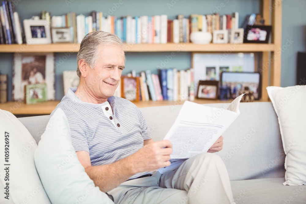 Happy senior man reading newspaper Happy senior man reading newspaper