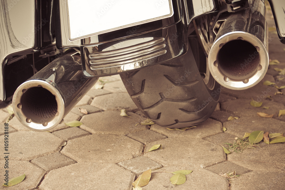 Motorcycle  double exhaust sepia background