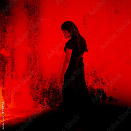 Black witch,Mysterious girl in black dress standing in abandon place,Horror background for halloween concept and movie poster project