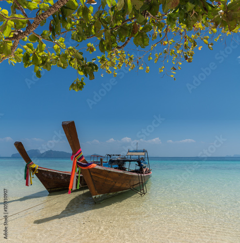 Thai boat longtail boat on the sea beach © sorapop