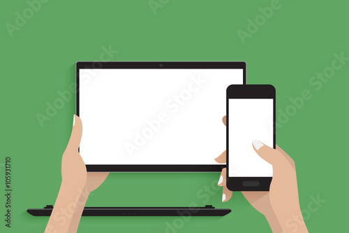 Using modern laptop with detachable screen and smartphone. Green background.