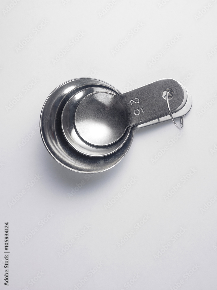 stainless steel measuring spoon on white background stainless steel measuring spoon on white background