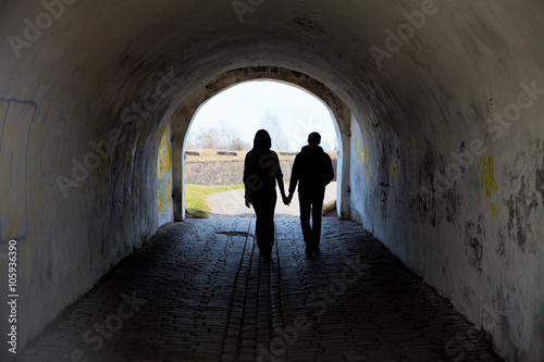 silhouette of two people