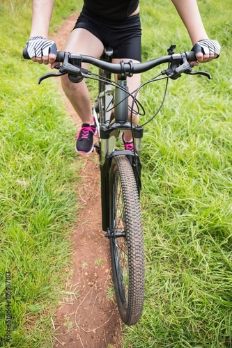 Close-up of woman cycling