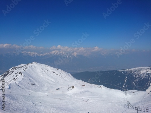 Skiing At Axamer Lizum With View To Innsbruck In Tyrol Austria © René Pi