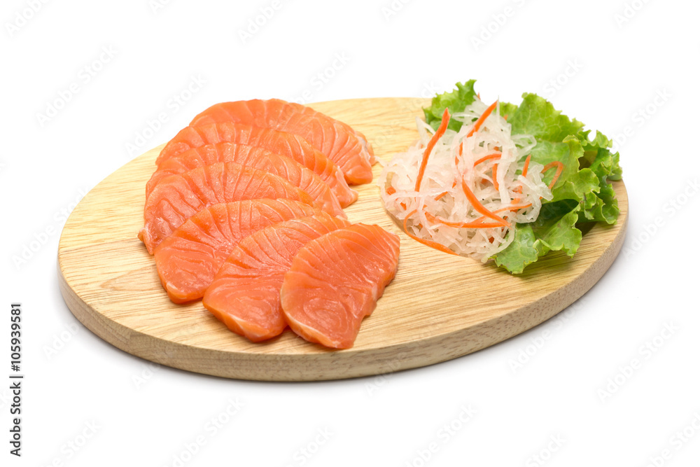 sliced salmon on wood background