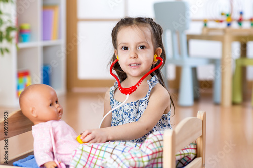 Kid toddler playing doctor ...