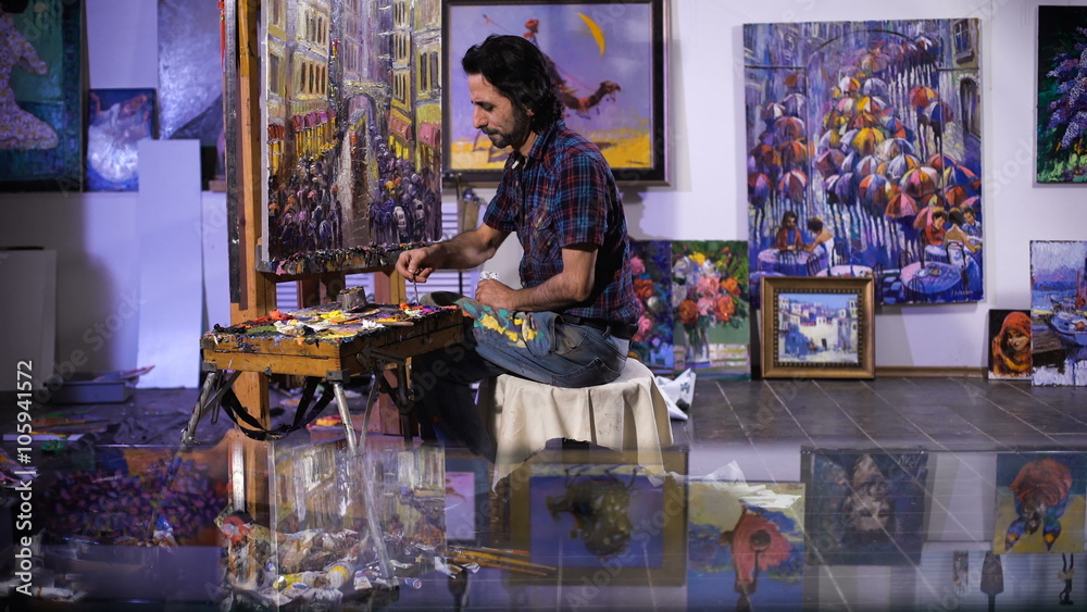 creation. senior man painting on a canvas creation. senior man painting on a canvas