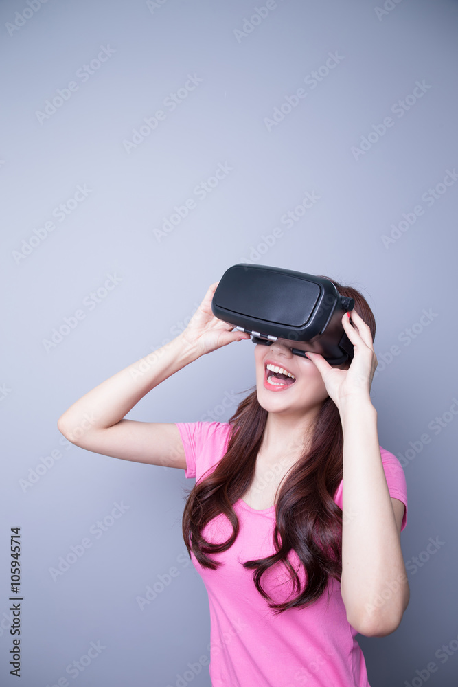 Happy woman watching virtual reality Happy woman watching virtual reality