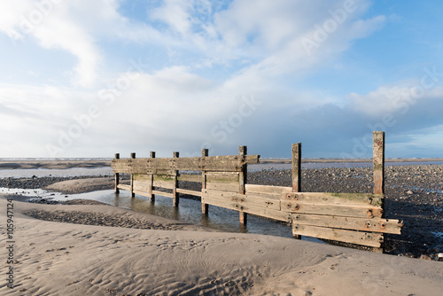 cleveleys  england  02 17 2016  A rustic  weathered wooden sea defence wall  showing signs of damage...